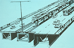 Widening of the bridge began in 1960, according to a new concept. The original two main girders carry the loads of the trams, and the two new girders carry the road traffic.
